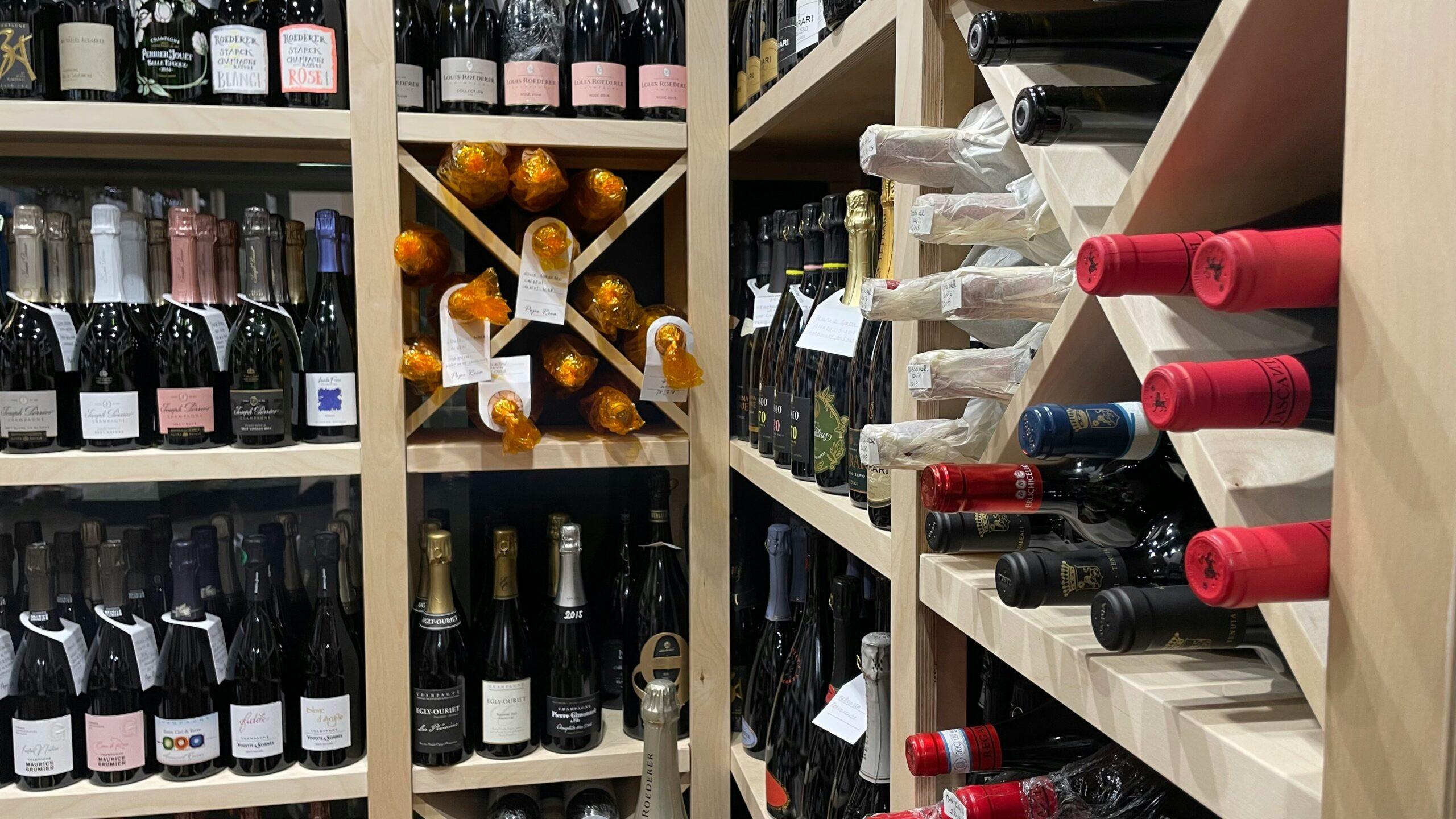 a wine rack filled with lots of bottles of wine